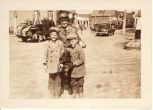 Roland and Bob Gilbert, with family friend in military